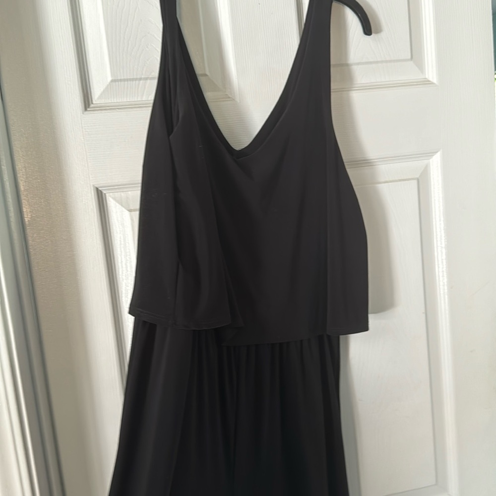 Woman’s black strap pant romper.